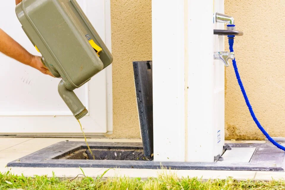 emptying the chemical toilet